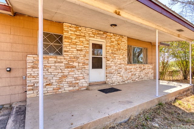 property entrance with a patio