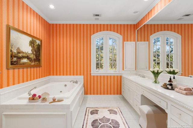 bathroom featuring vanity, crown molding, a bathtub, and tile patterned flooring