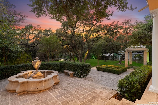 view of patio terrace at dusk