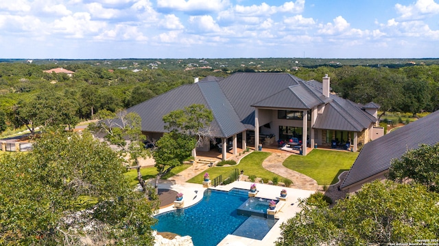 view of swimming pool with a patio and a yard