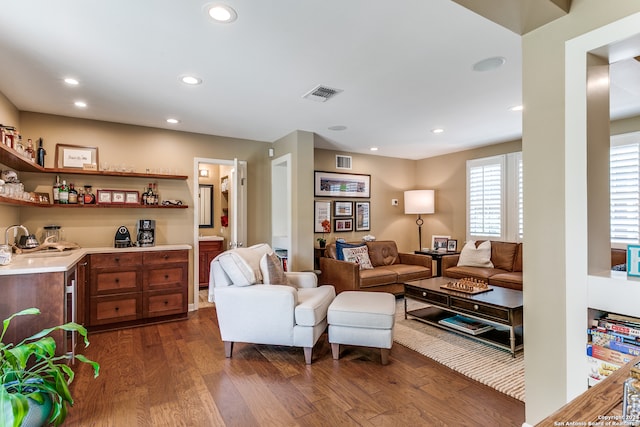 living room with dark hardwood / wood-style flooring