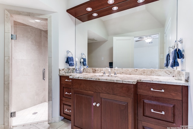 bathroom with vanity, tile patterned flooring, and a shower with door