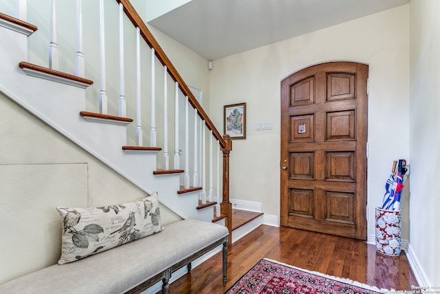 entrance foyer featuring dark wood-type flooring