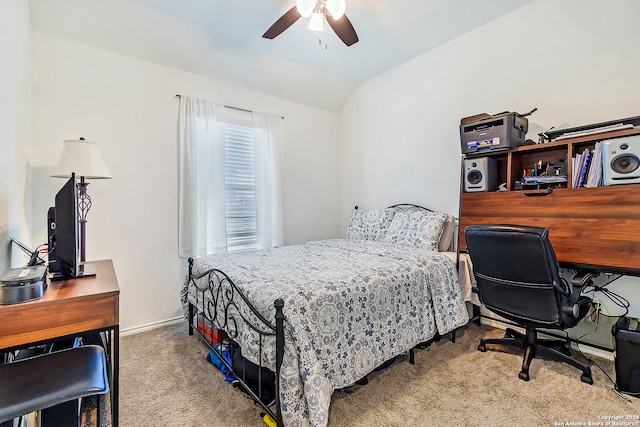 bedroom with ceiling fan, light carpet, and lofted ceiling