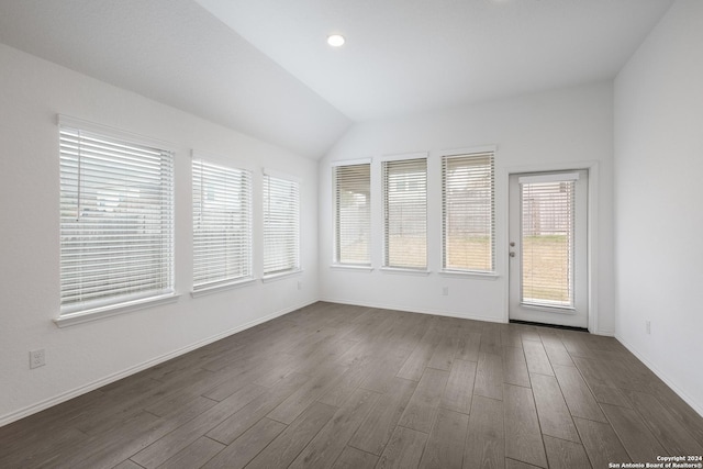 2721 Barkey Spgs, San Antonio, TX 78245 - spare room featuring recessed lighting, baseboards, vaulted ceiling, and dark wood-style floors