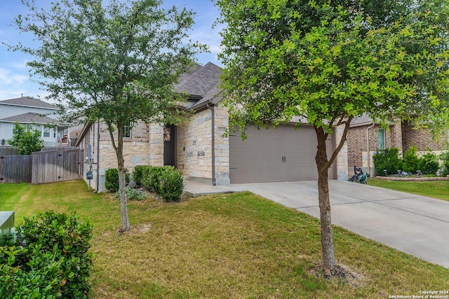 obstructed view of property with a front lawn