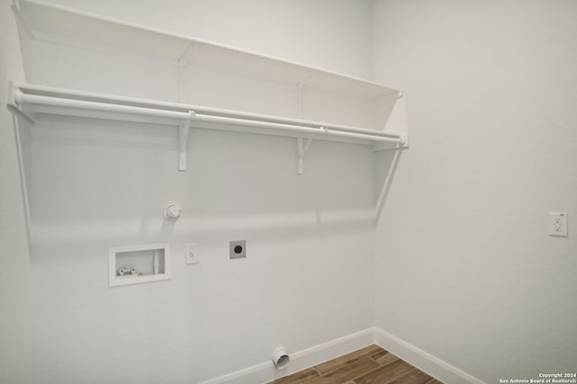 laundry area with hookup for a gas dryer, washer hookup, dark hardwood / wood-style floors, and hookup for an electric dryer