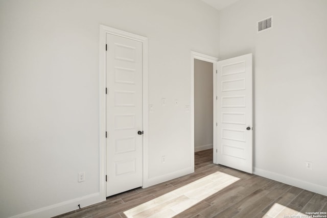 unfurnished bedroom featuring hardwood / wood-style floors