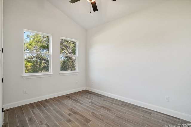 unfurnished room featuring hardwood / wood-style flooring, high vaulted ceiling, and ceiling fan