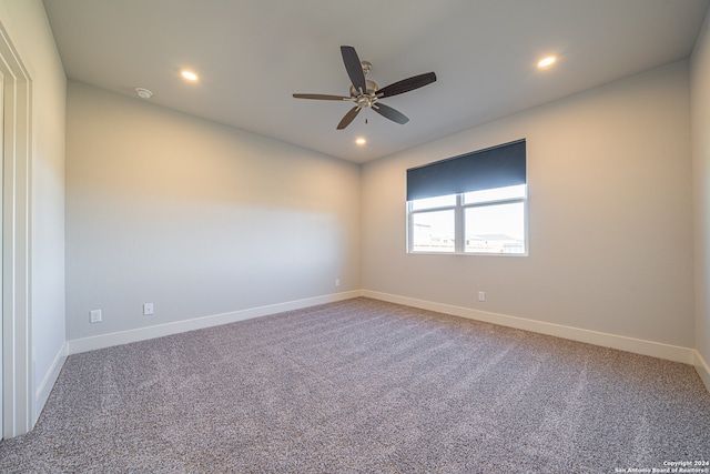 unfurnished room featuring carpet and ceiling fan