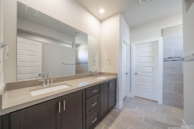 bathroom featuring tile patterned floors and vanity