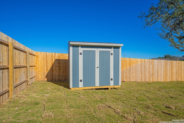 view of outdoor structure with a lawn