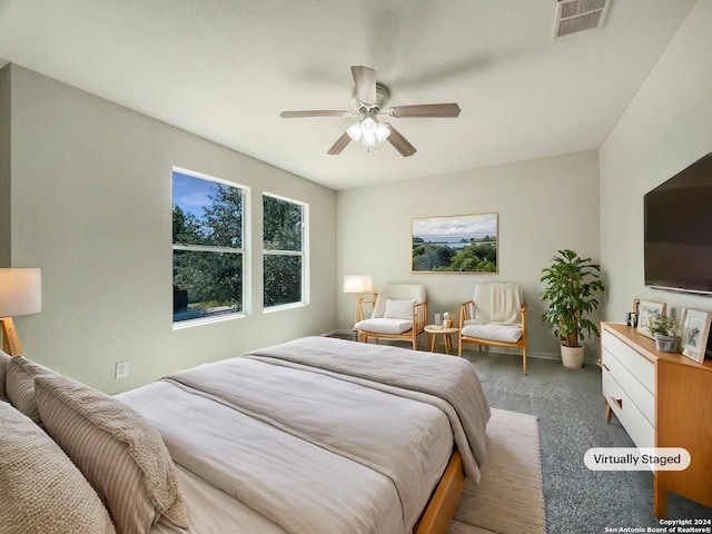 carpeted bedroom featuring ceiling fan