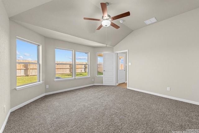 carpeted empty room featuring ceiling fan and vaulted ceiling