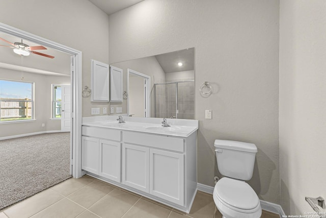 bathroom with vanity, tile patterned flooring, ceiling fan, toilet, and walk in shower