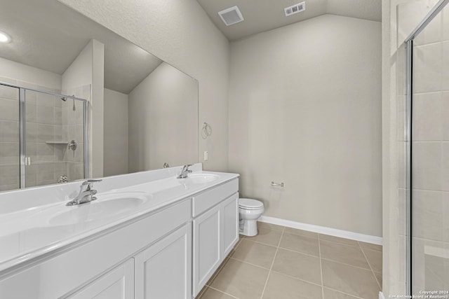 bathroom with tile patterned floors, an enclosed shower, vanity, vaulted ceiling, and toilet