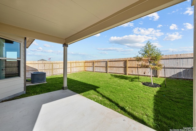 view of yard featuring central air condition unit and a patio