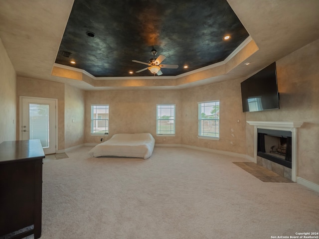 unfurnished bedroom with light carpet, crown molding, and a raised ceiling