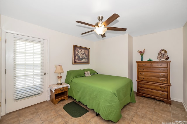 bedroom featuring light tile patterned flooring and ceiling fan