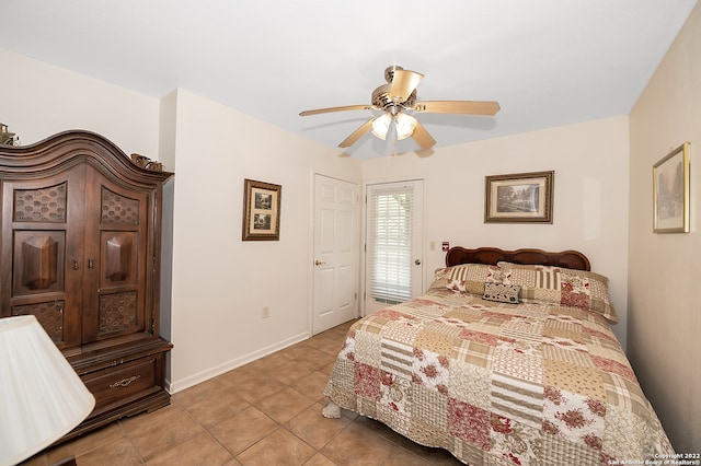 bedroom with ceiling fan and light tile patterned floors