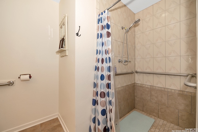 bathroom featuring tile patterned flooring and a shower with shower curtain