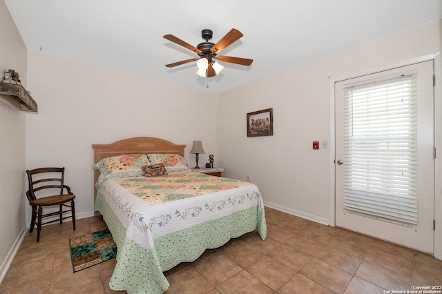 bedroom featuring ceiling fan and tile patterned flooring