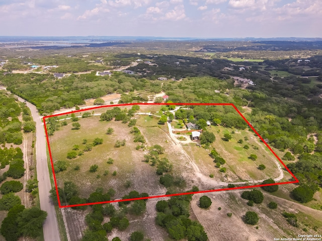 birds eye view of property with a rural view