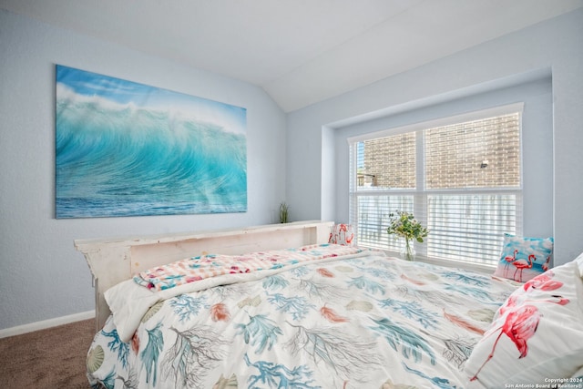 bedroom featuring lofted ceiling and carpet flooring