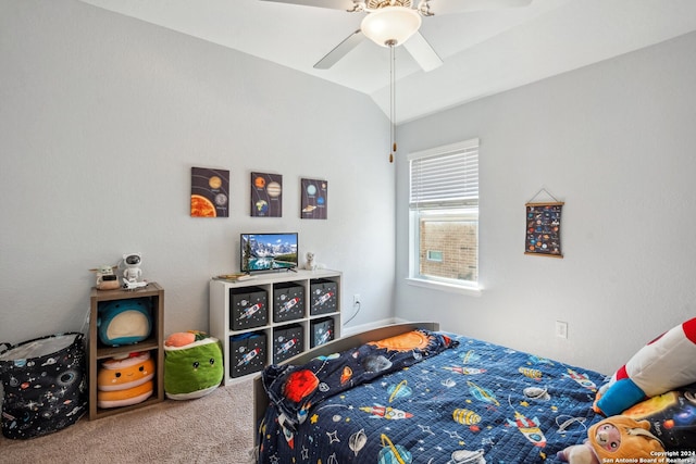 carpeted bedroom featuring vaulted ceiling and ceiling fan