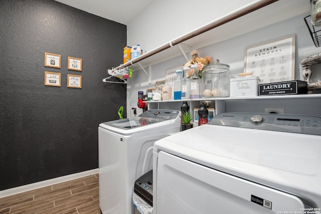 laundry area featuring dark hardwood / wood-style floors and independent washer and dryer