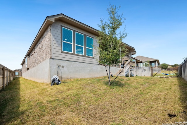 view of home's exterior with a lawn