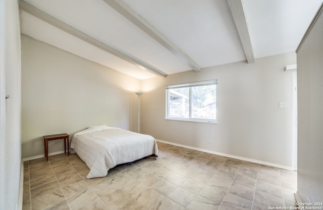 bedroom with beamed ceiling