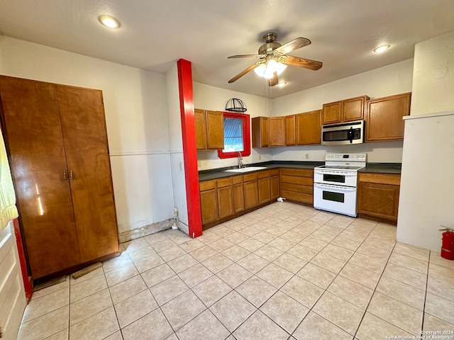 kitchen featuring light tile patterned flooring, ceiling fan, sink, and white electric range