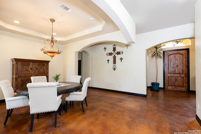 dining area featuring a tray ceiling