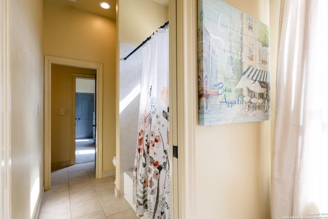 hallway with light tile patterned floors