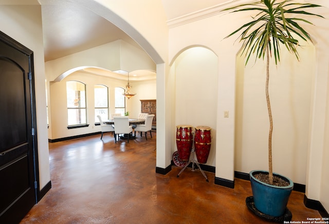 foyer featuring ornamental molding