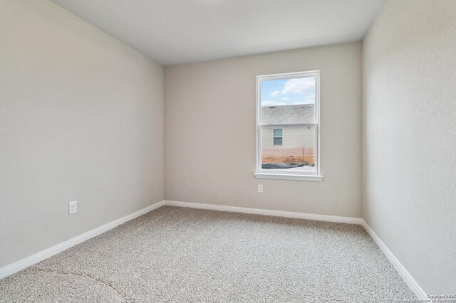 spare room featuring carpet floors