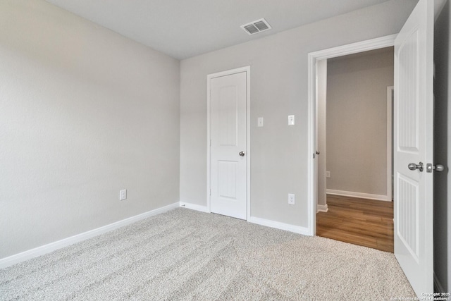 unfurnished bedroom with carpet floors