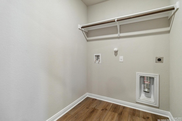 clothes washing area with hardwood / wood-style flooring, hookup for an electric dryer, hookup for a gas dryer, and hookup for a washing machine