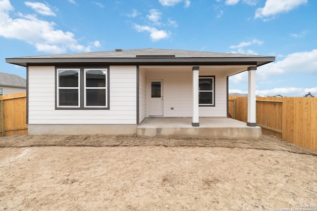 rear view of property featuring a patio area