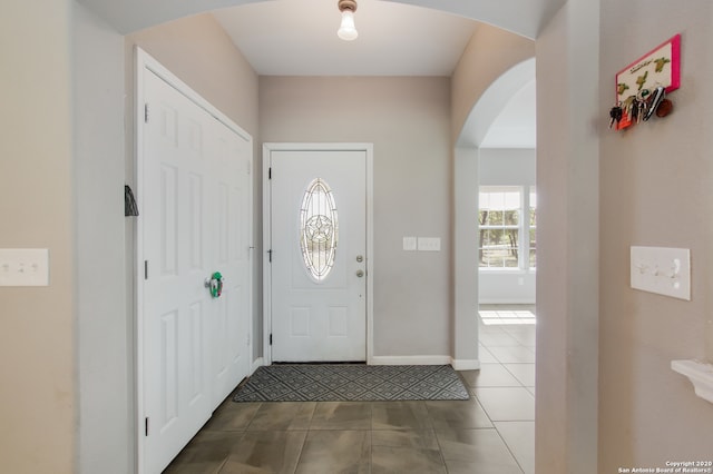 foyer entrance with tile patterned floors