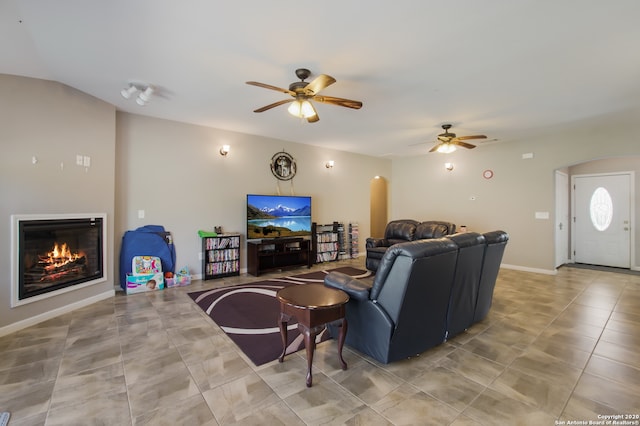 tiled living room featuring ceiling fan