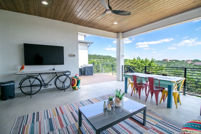 view of patio with a grill, a balcony, and ceiling fan