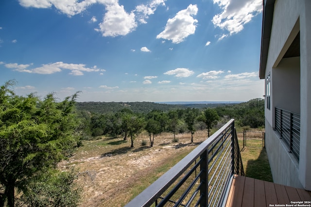 balcony featuring a rural view