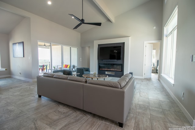 living room with ceiling fan, beam ceiling, and high vaulted ceiling