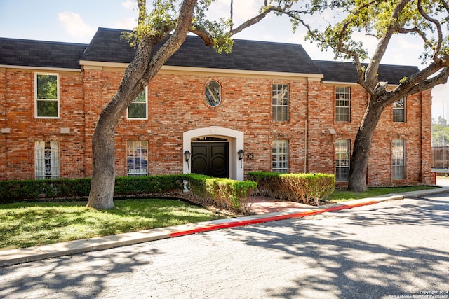 tudor house with a front yard