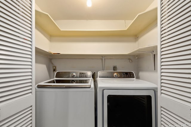 laundry area with washing machine and clothes dryer