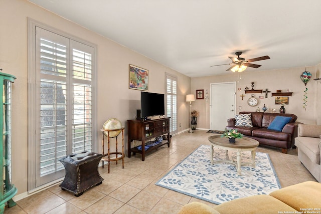 tiled living room featuring ceiling fan