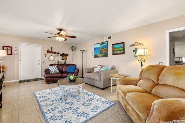 living room featuring ceiling fan and tile patterned flooring