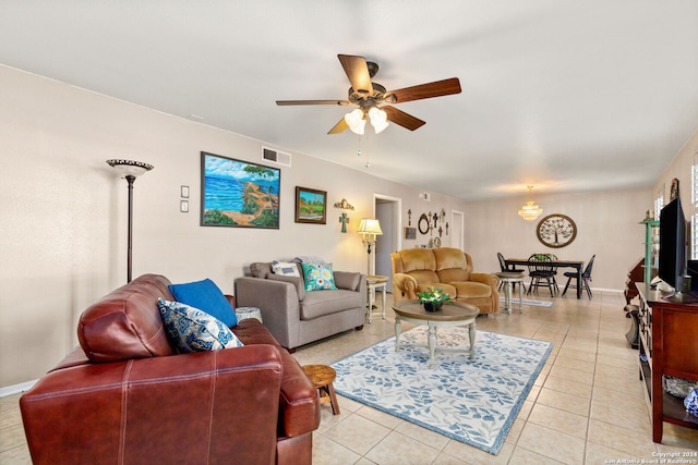 tiled living room with ceiling fan